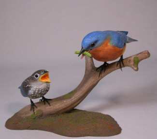 Carved Eastern Bluebird Male Offering Worm to Baby